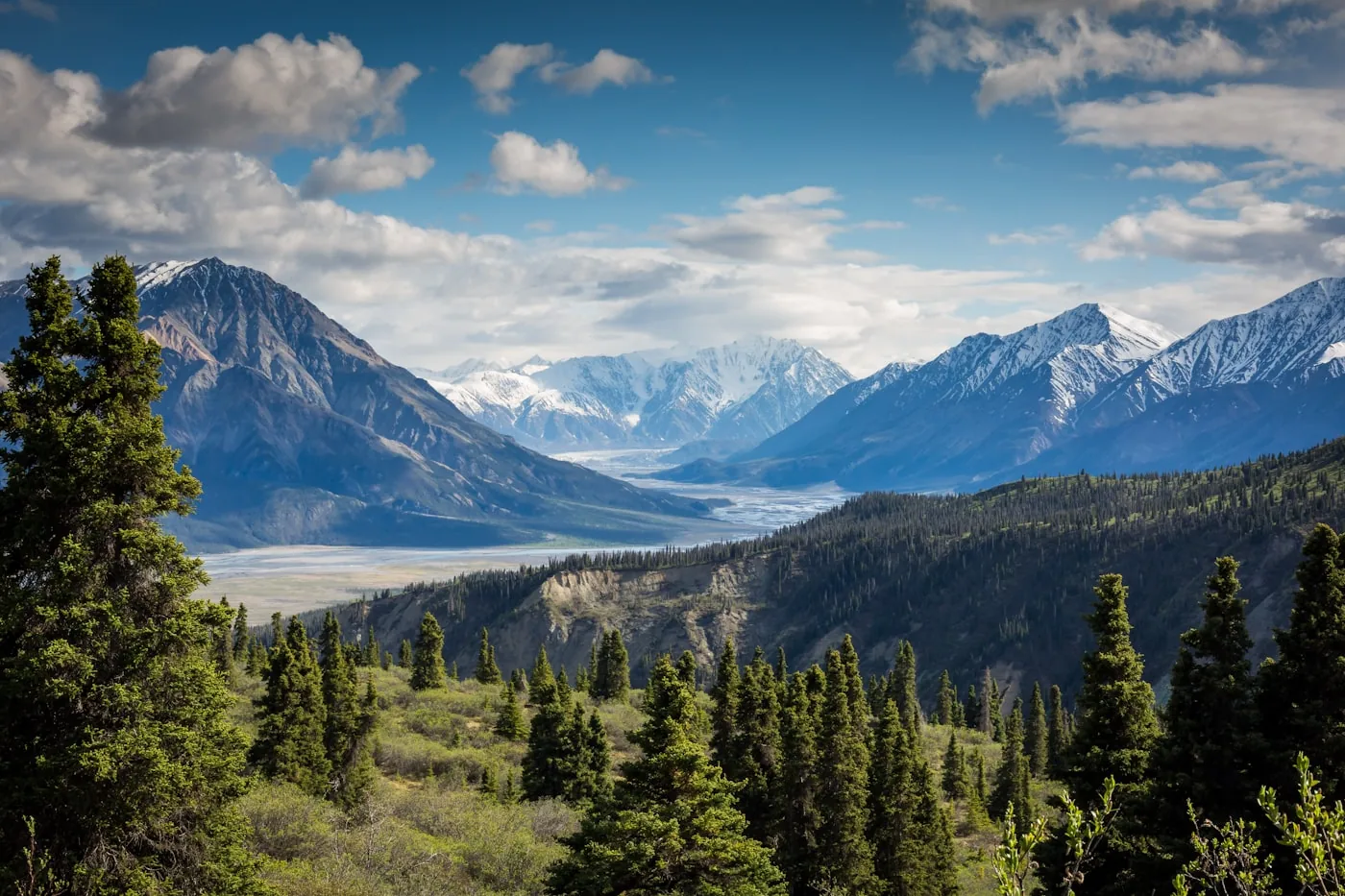 Snow-capped alpine mountain peaks under a clear blue sky
